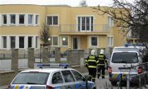 Firefighters search an area after an explosion in Prague January 1, 2014. REUTERS/David W Cerny