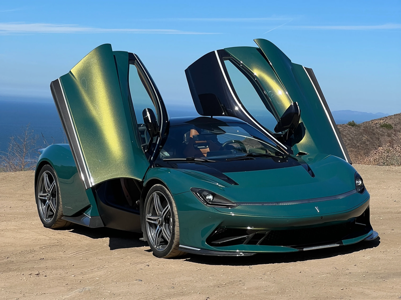 Front 3/4 view of a green Pininfarina Battista with the doors open