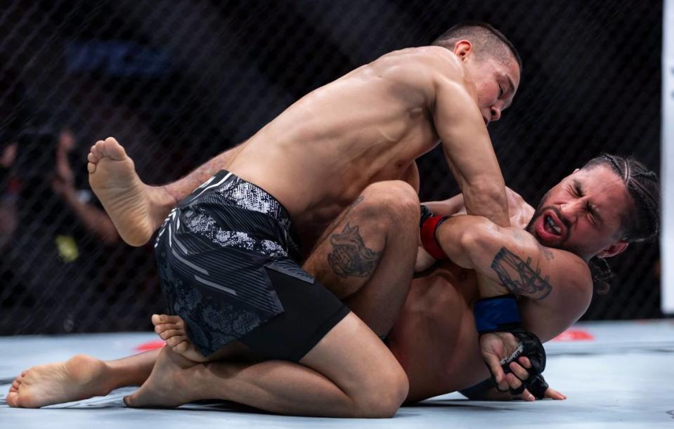 CJ Vergara from the United States and Asu Almabayev from Kazakhstan fight during their flyweight title match during the UFC 299 event at the Kaseya Center on Saturday, March 9, 2024, in downtown Miami, Fla. MATIAS J. OCNER/mocner@miamiherald.com