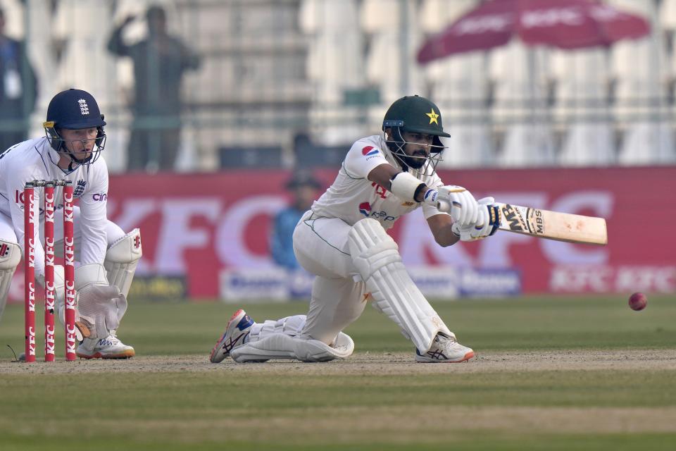 Pakistan Saud Shakeel, right, bats during the second day of the second test cricket match between Pakistan and England, in Multan, Pakistan, Saturday, Dec. 10, 2022. (AP Photo/Anjum Naveed)