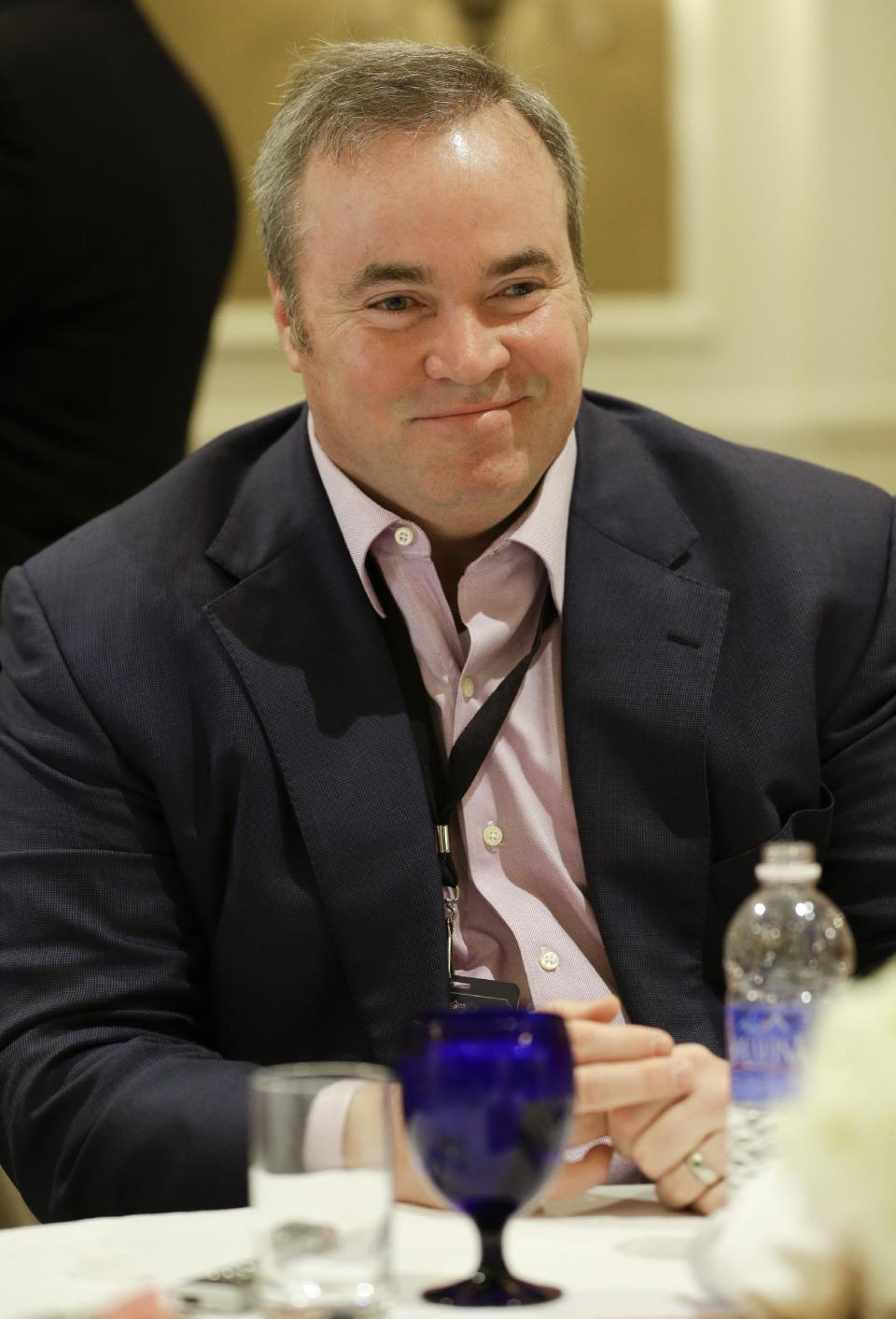 Green Bay Packers head coach Mike McCarthy talks with reporters during the NFC Head Coaches Breakfast at the NFL football meetings in Orlando, Fla., Wednesday, March 26, 2014. (AP Photo/John Raoux)