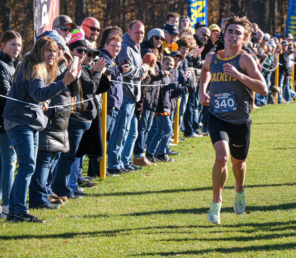 Ithaca senior Parks Allen (340) is on his way to a first-place finish in the Boys Regional Cross Country race Saturday, Oct, 29, 2022.