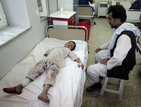 An Afghan boy receives treatment at a hospital after a bomb blast in northern Mazar-i-Sharif, Afghanistan October 12, 2016. REUTERS/ Anil Usyan