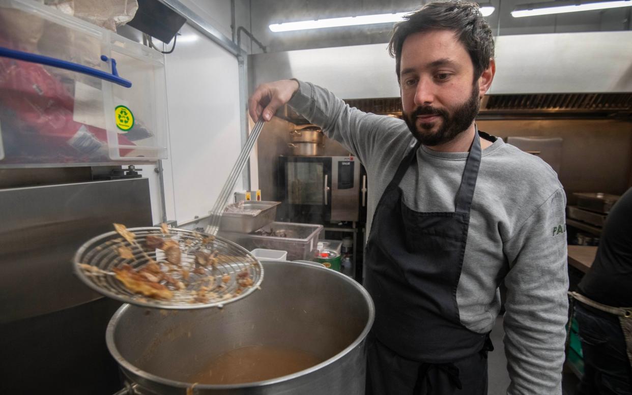 Nicholas Fitzgerald prepares food for Tacos Padre at Karma Kitchen's unit in Bermondsey