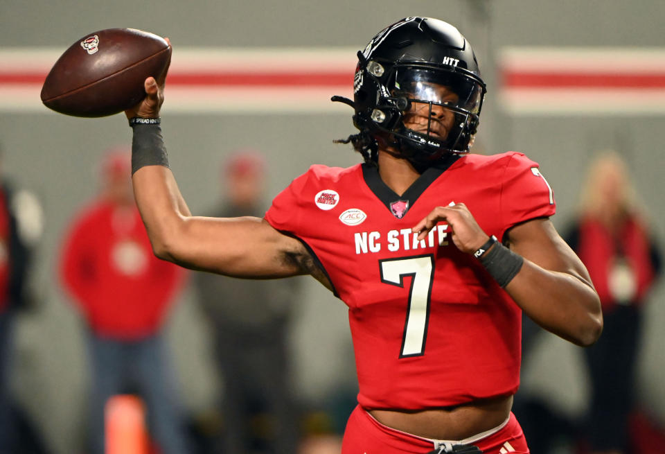 Nov 4, 2023; Raleigh, North Carolina, USA; North Carolina State Wolfpack quarterback MJ Morris (7) throws a pass during the first half against the Miami Hurricanes at Carter-Finley Stadium. Mandatory Credit: Rob Kinnan-USA TODAY Sports