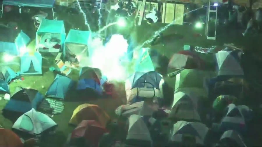 A firework was ignited and thrown into an pro-Palestinian encampment at the UCLA campus on April 30, 2024. (KTLA)