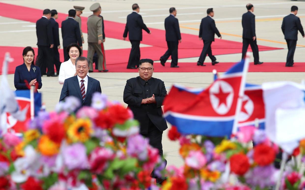 South Korean President Moon Jae-in is greeted by North Korean leader Kim Jong Un in Pyongyang - REUTERS