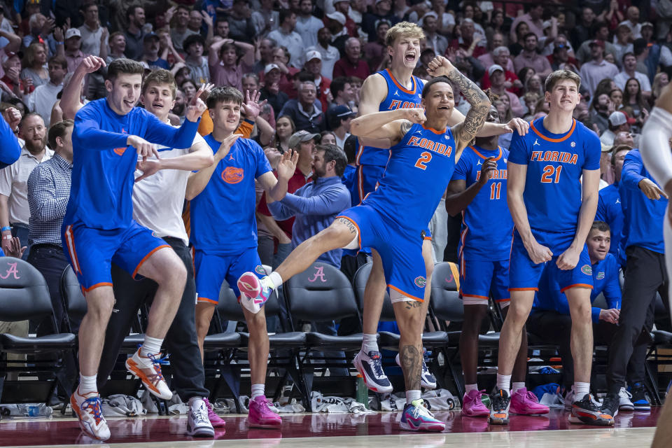 Florida's bench celebrates a score against Alabama late in the second half of an NCAA college basketball game Wednesday, Feb. 21, 2024, in Tuscaloosa, Ala. (AP Photo/Vasha Hunt)