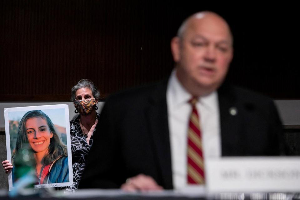 PHOTO: In this June 17, 2020, file photo, Nadia Milleron, mother of Samya Stumo holds a photo of her daughter as FAA Administrator Stephen Dickson waits to speak during a hearing on Capitol Hill, in Washington, D.C. (Pool via Reuters, FILE)