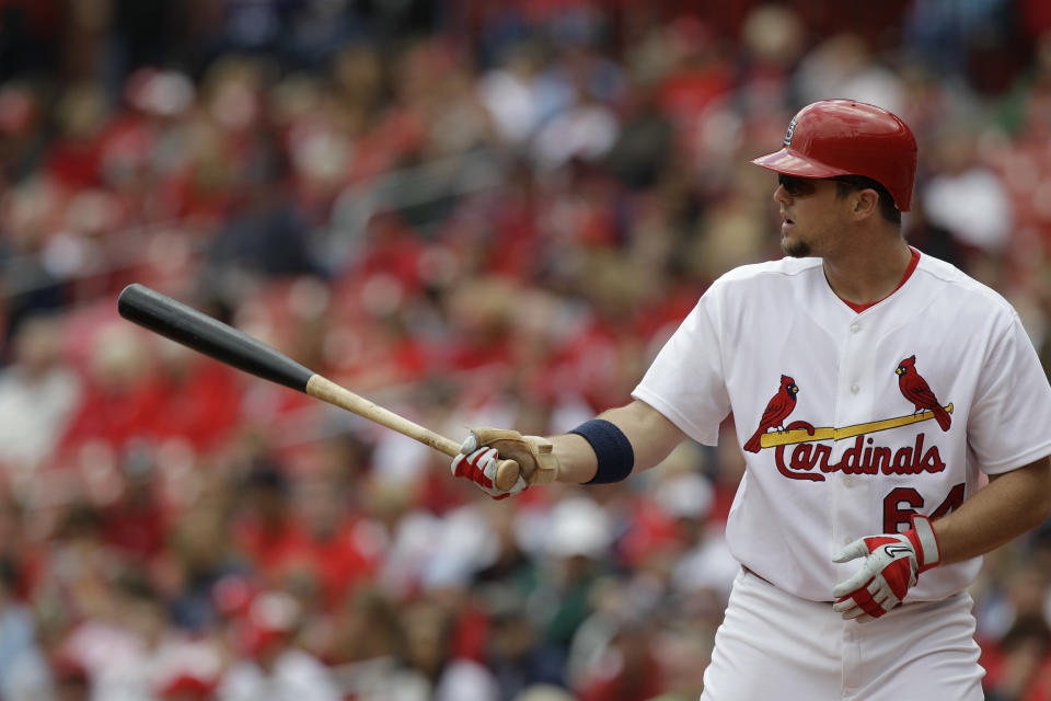 FILE - In this Oct. 2, 2010, file photo, St. Louis Cardinals' Mark Hamilton bats during a baseball game against the Colorado Rockies in St. Louis. On Friday, April 10, 2020, under an accelerated schedule prompted by dire circumstances, the former big leaguer is set to graduate a month early from medical school on Long Island. Next stop for the rookie doc, most likely, the first-hand fight against the coronavirus pandemic. (AP Photo/Jeff Roberson, File)