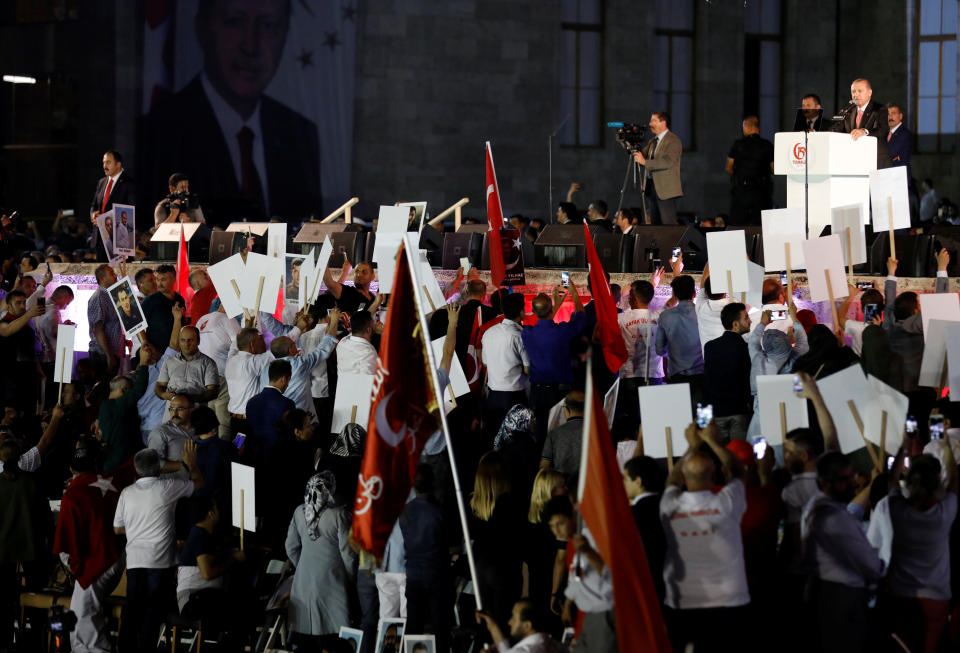 Turkey's President Tayyip Erdogan addresses his supporters during a ceremony marking the first anniversary of the attempted coup in front of the Turkish Parliament in Ankara, Turkey July 16, 2017. REUTERS/Umit Bektas