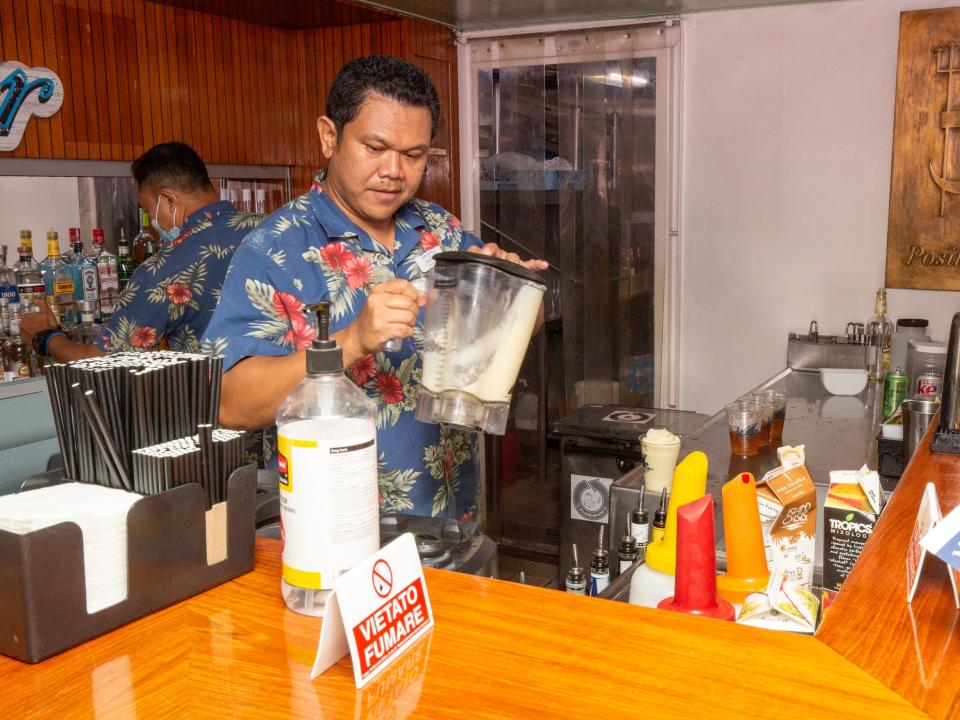 A bartender making drinks in a bartender.