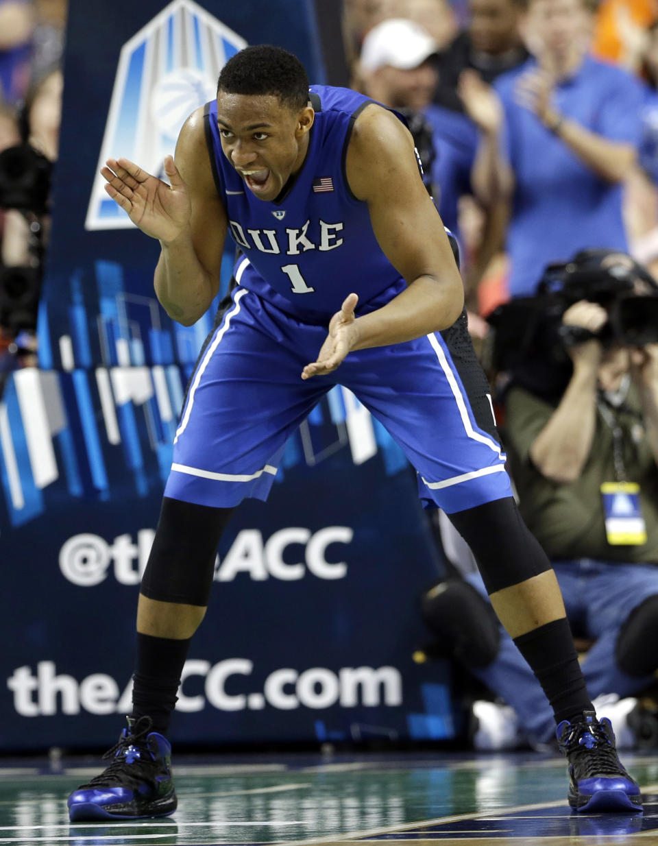 FILE - In this March 16, 2014 file photo, Duke's Jabari Parker (1) celebrates after making a basket against Virginia during the second half of an NCAA college basketball game in the championship of the Atlantic Coast Conference tournament in Greensboro, N.C. Parker was selected to The Associated Press All-America team, released Monday, March 31, 2014. (AP Photo/Gerry Broome)