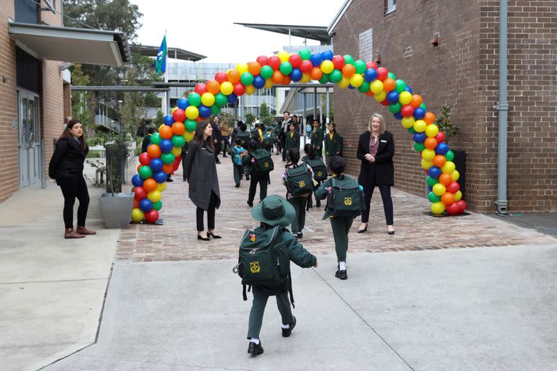 Children return to campus for the first day of New South Wales public schools fully re-opening in Sydney