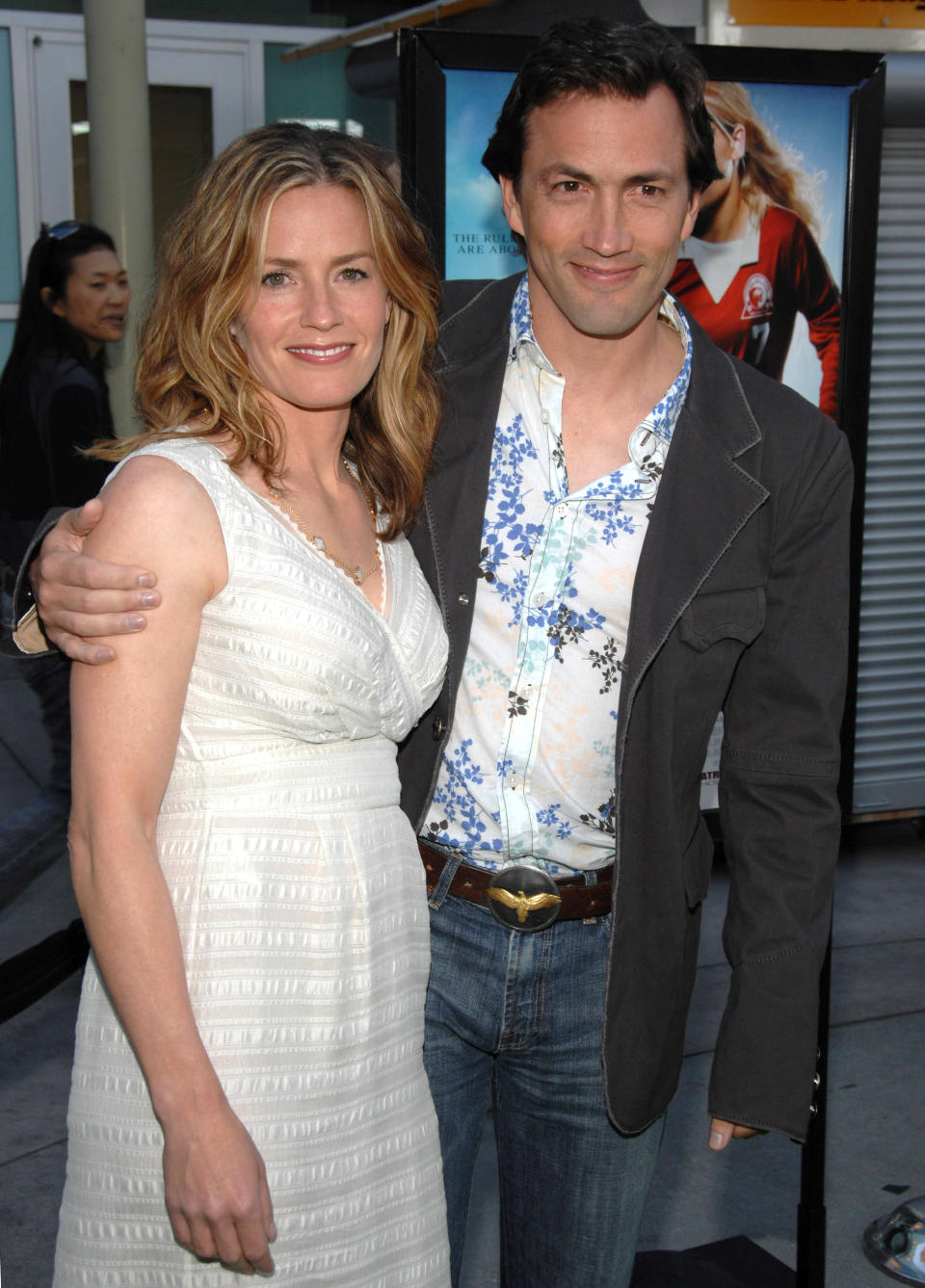 Elisabeth Shue and her brother Andrew Shue stand together smiling 