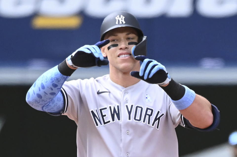 New York Yankess' Aaron Judge motions to the dugout after hitting an RBI-double, scoring Joey Gallo, in fifth-inning baseball game action against the Toronto Blue Jays in Toronto, Sunday, June 19, 2022. (Jon Blacker/The Canadian Press via AP)