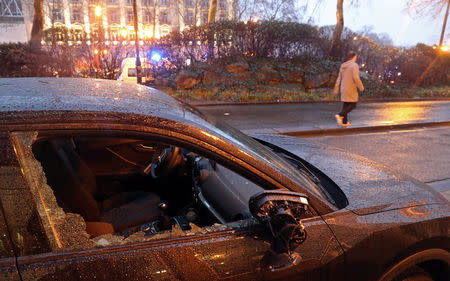 A destroyed car is seen after the "yellow vests" protest against higher fuel prices, in Brussels, Belgium, December 8, 2018. REUTERS/Yves Herman