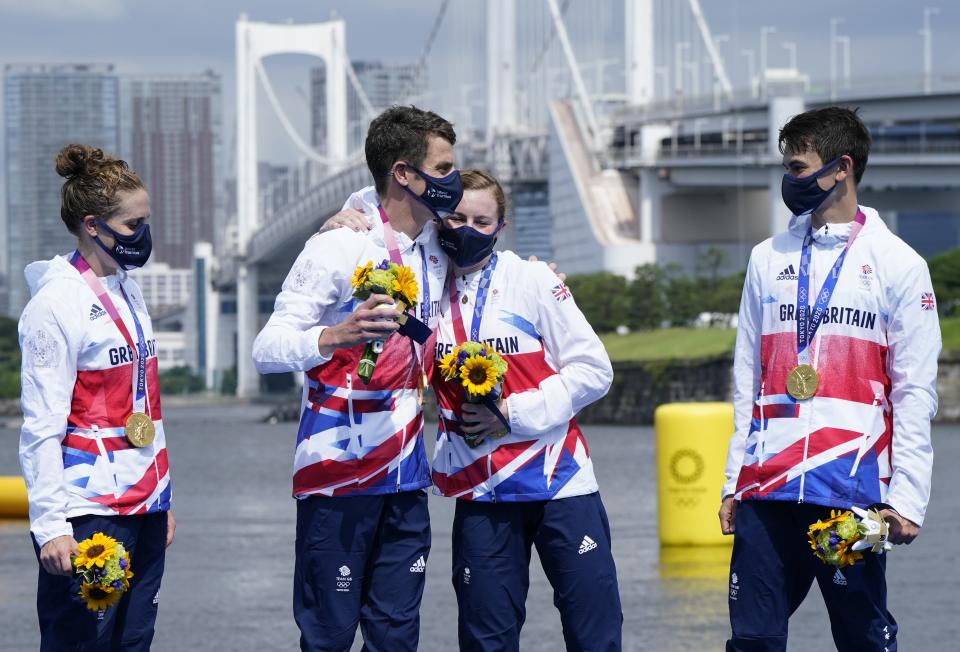 Great Britain’s Jessica Learmonth, Jonathan Brownlee, Georgia Taylor-Brown and Alex Yee on the podium with the gold medal (Danny Lawson/PA) (PA Wire)