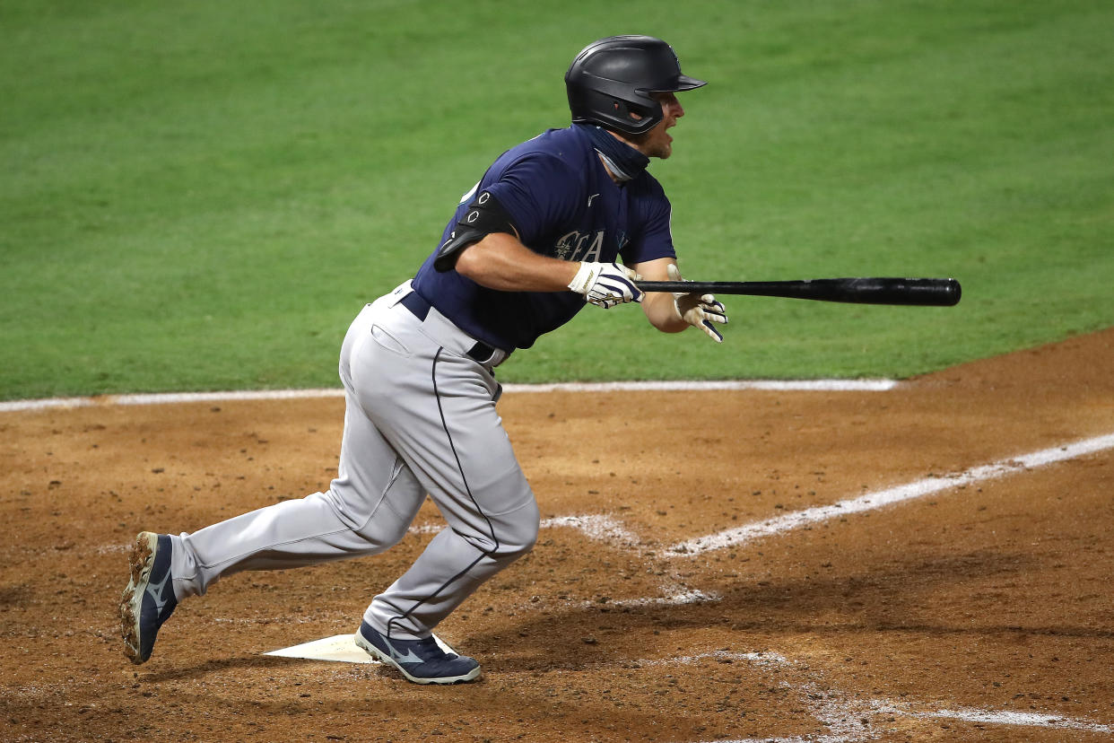 ANAHEIM, CALIFORNIA - JULY 29:  Kyle Seager #15 of the Seattle Mariners runs to first after hitting an RBI single during the sixth inning of a game against the Los Angeles Angels at Angel Stadium of Anaheim on July 29, 2020 in Anaheim, California. (Photo by Sean M. Haffey/Getty Images)