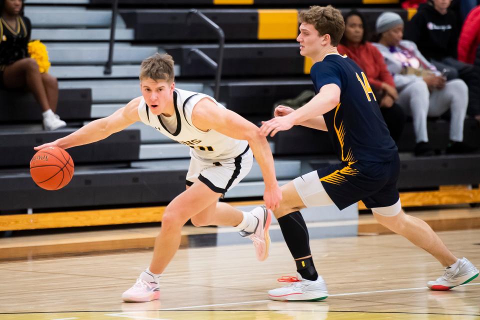 Red Lion's Joe Sedora dribbles around Greencastle-Antrim's Conner Wright (14) in the second half of non-league basketball game Jan. 24, 2024, at Red Lion Area High School. The Lions won, 57-38.
