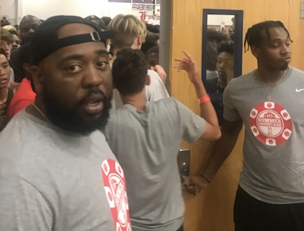 Fans crowd the door outside the gym where LeBron James had come to watch his son play a grassroots game in Las Vegas. (Yahoo Sports)