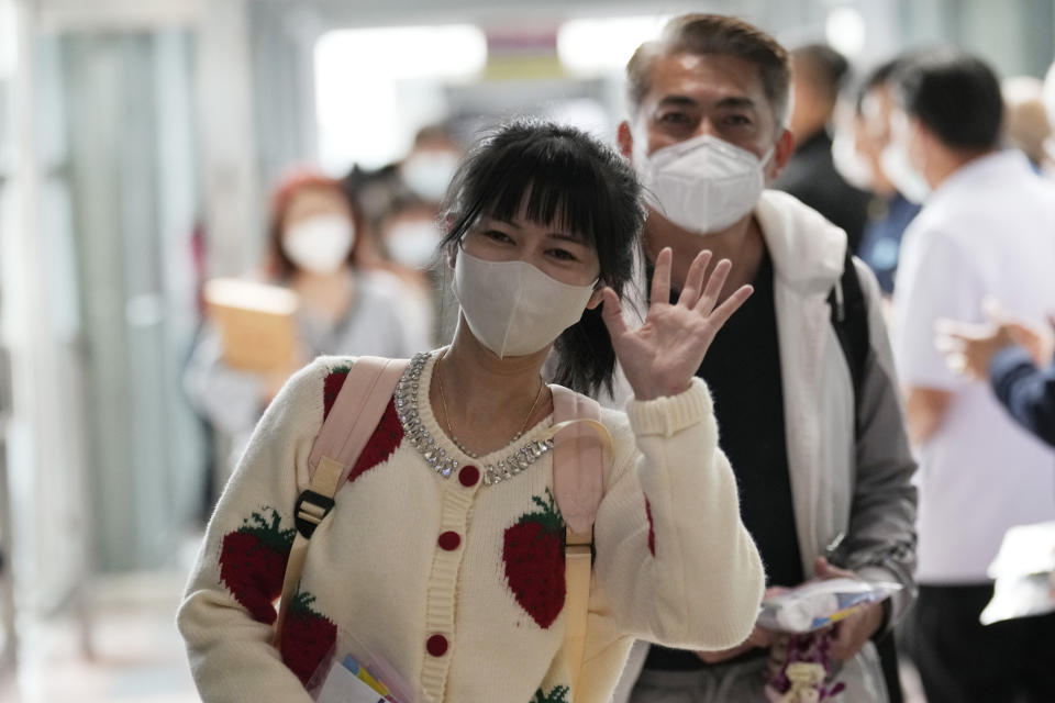 Chinese tourists arrive at Suvarnabhumi International Airport in Samut Prakarn province, Thailand, Monday, Jan. 9, 2023. Thailand is looking forward to hosting large numbers of vistos from China again after Beijing eased travel restrictions on Sunday. Chinese were about one-third of the total number of tourists visiting Thailand before the coronavirus pandemic, and the authorities hope they can help its lucrative tourism industry recover.(AP Photo/Sakchai Lalit)