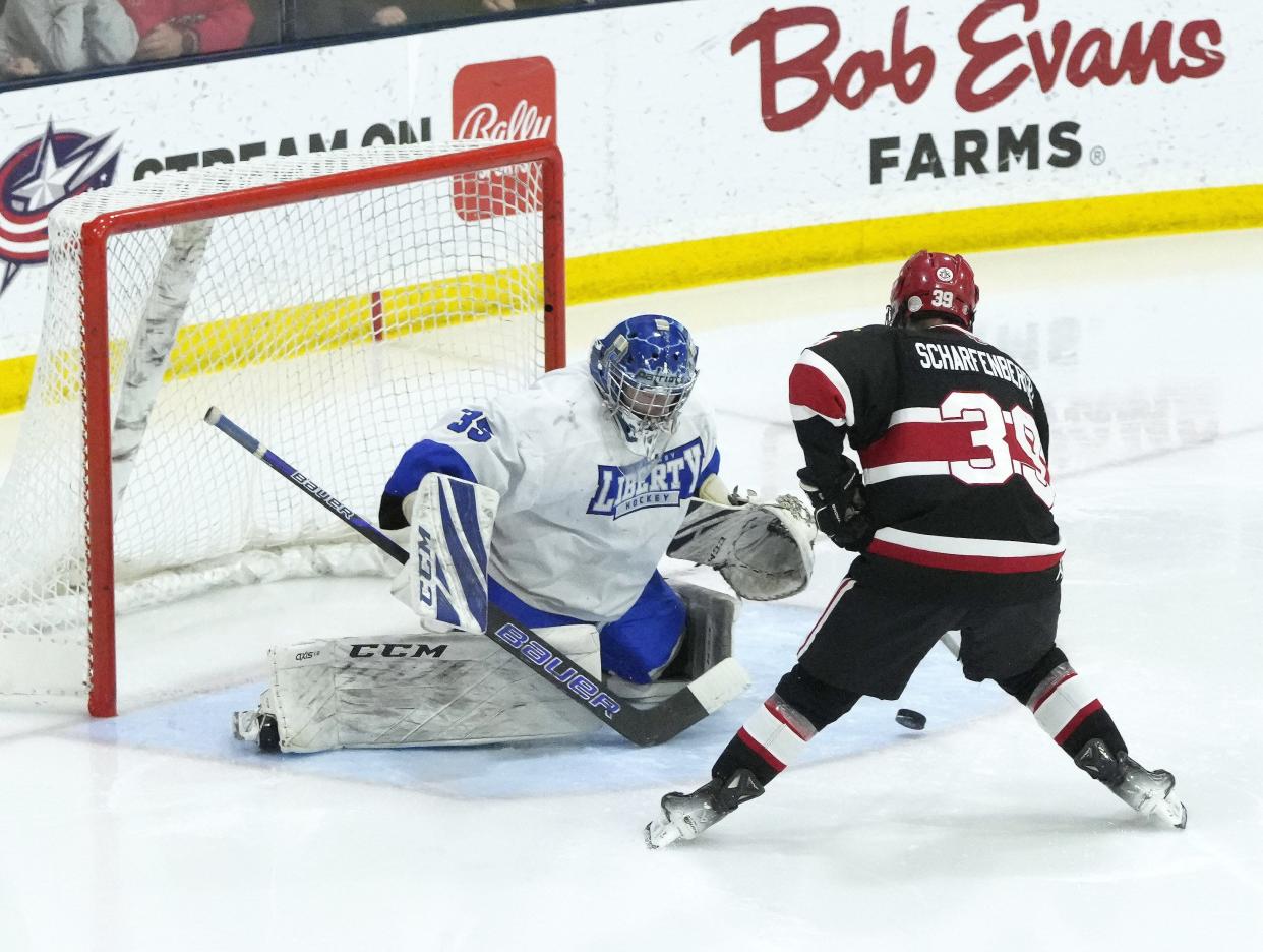 St. Charles' Nick Scharfenberger scores past Olentangy Liberty goalie Caleb Ross.