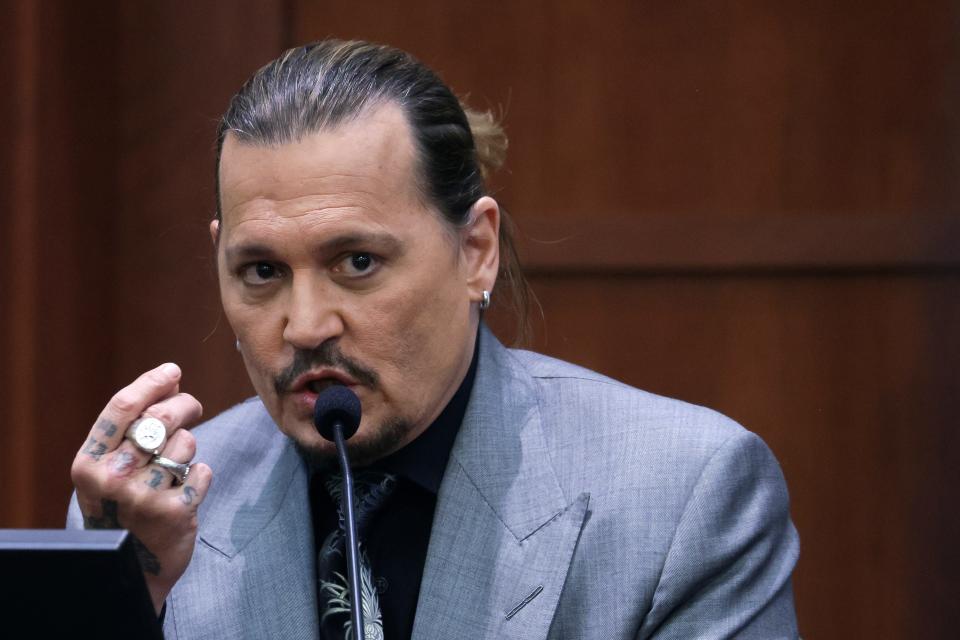 Actor Johnny Depp testifies during a hearing in the courtroom at the Fairfax County Circuit Court in Fairfax, Va., on April 20, 2022.