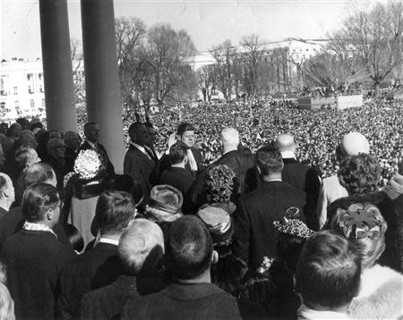Former U.S. Supreme Court Chief Justice Earl Warren (C) administers the oath of office to former President John F. Kennedy (center-left) during inauguration ceremonies at the Capitol in Washington, in this handout photograph taken on January 20, 1961. REUTERS/Cecil Stoughton/The White House/John F. Kennedy Presidential Library