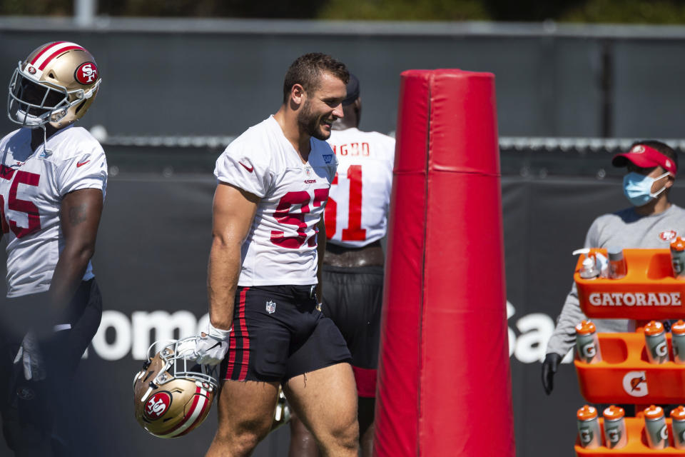 San Francisco 49ers defensive end Nick Bosa (97) walks in beat to the music during NFL Training Camp practice Saturday, Aug. 15, 2020, at the SAP Performance Facility in Santa Clara, Calif. (Xavier Mascarenas/The Sacramento Bee via AP)