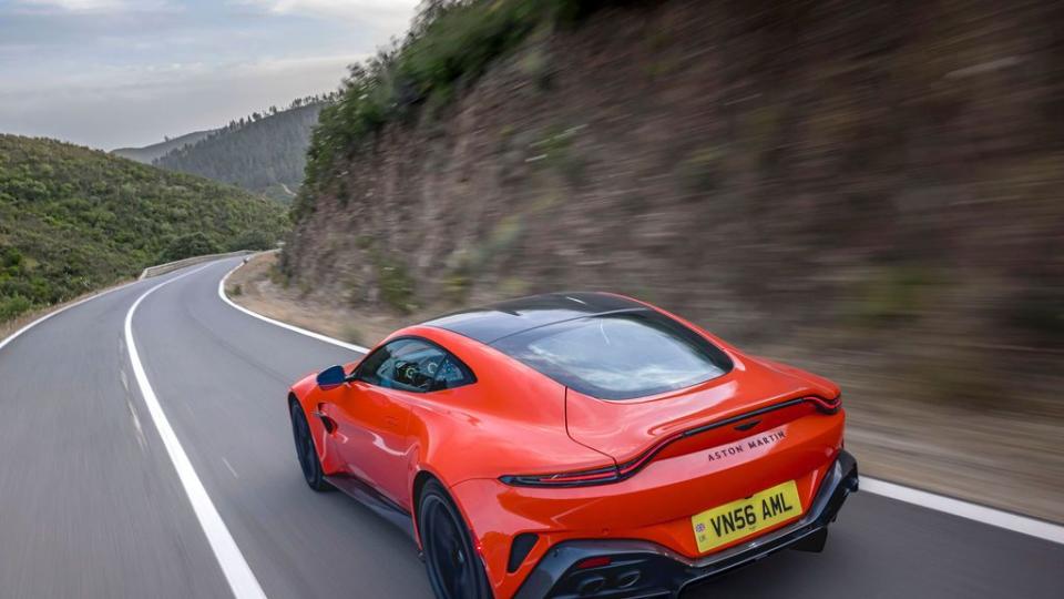 a red sports car on a road