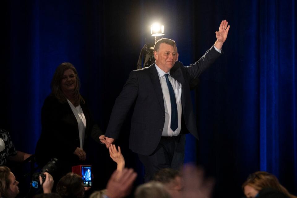 Dennis King, right, leader of the Progressive Conservative Party of P.E.I., arrives with his wife Jana Hemphill to celebrate a majority government with supporters at his election night headquarters in Charlottetown, P.E.I. on Monday, April 3, 2023. THE CANADIAN PRESS/