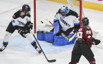 Montreal's Marie-Philip Poulin (29) takes a shot on Toronto goaltender Kristen Campbell as Toronto's Renata Fast (14) defends during the second period of a PWHL hockey game at the Bell Centre in Montreal, Saturday, April 20, 2024.(Graham Hughes/The Canadian Press via AP)