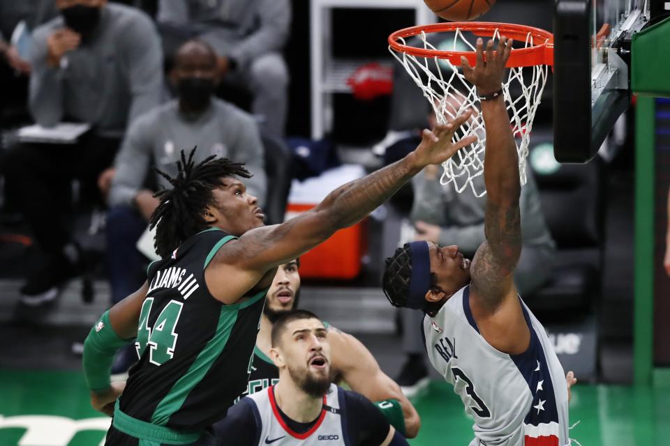 Boston Celtics' Robert Williams III (44) blocks a shot by Washington Wizards' Bradley Beal (3) during the first half of an NBA basketball game, Sunday, Feb. 28, 2021, in Boston. (AP Photo/Michael Dwyer)