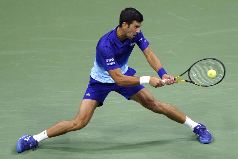 Novak Djokovic, of Serbia, returns against Jenson Brooksby, of the United States, during the fourth round of the U.S. Open tennis championships, Monday, Sept. 6, 2021, in New York. (AP Photo/John Minchillo)