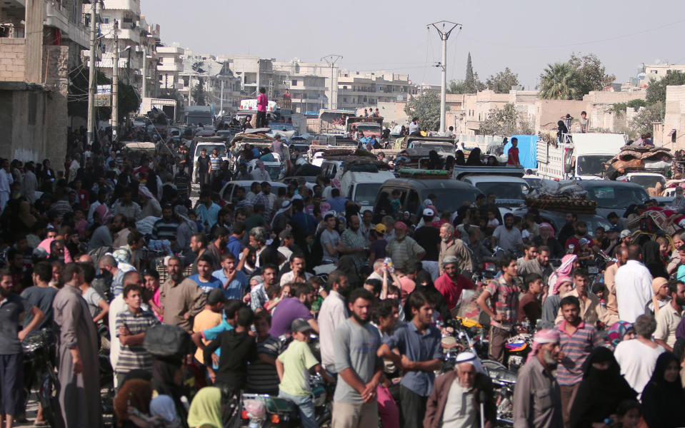 <p>Civilians gather after they were evacuated by the Syria Democratic Forces (SDF) fighters from an Islamic State-controlled neighbourhood of Manbij, in Aleppo Governorate, Syria, Aug. 12, 2016. (REUTERS/Rodi Said) </p>