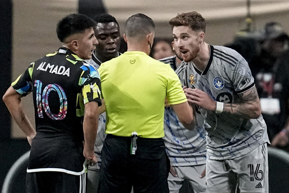 CF Montréal defender Joel Waterman (16) speaks with an official before leaving the game against Atlanta United during the second half of a MLS soccer match, Saturday, Sept. 23, 2023, in Atlanta. (AP Photo/Mike Stewart)