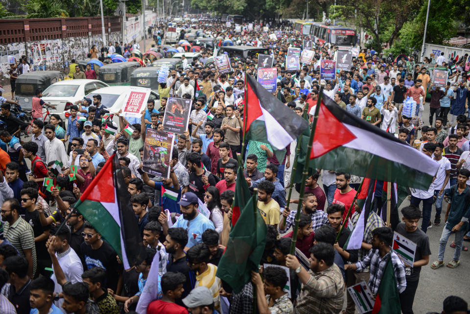 Bangladeshi students wave Palestinian flags, as they march during a pro- Palestinian demonstration at the Dhaka University area in Dhaka, Bangladesh, Monday, May 6, 2024. (AP Photo/ Mahmud Hossain Opu )