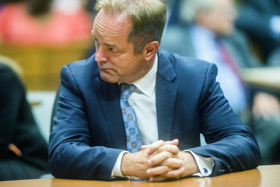 Special prosecutor Todd Flood waits before the preliminary examination of Nick Lyon on Monday, Aug. 20, 2018 at Genesee District Court in downtown Flint, Mich. Lyon is the director of the Michigan Department of Health and Human Services. Goggins ordered Lyons to stand trial for involuntary manslaughter in two deaths linked to Legionnaires' disease in the Flint area, the highest ranking official to stand trial as a result of the tainted water scandal. (Jake May/The Flint Journal via AP)