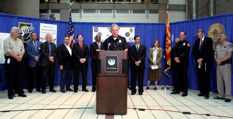 FILE PHOTO: Phoenix Police Chief Jack Harris talks to the media about the arrest of two suspects in the serial shooting case