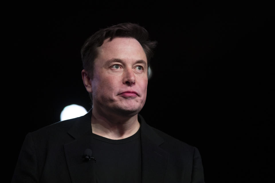 FILE - In this March 14, 2019, file photo Tesla CEO Elon Musk pauses while speaking before unveiling the Model Y at the company's design studio in Hawthorne, Calif. Musk will face the electric car maker's shareholders during the company's annual meeting on Tuesday, June 11. (AP Photo/Jae C. Hong, File)