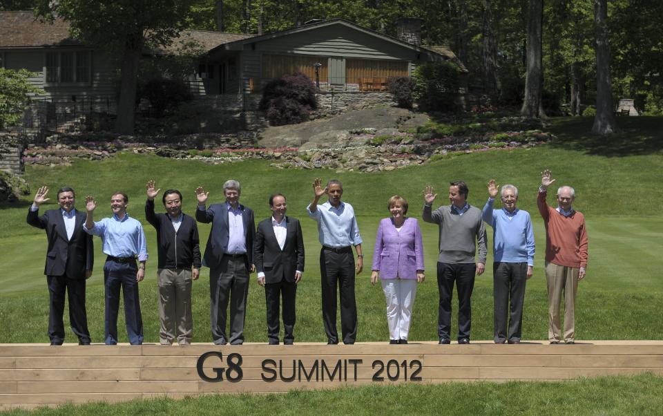 G8 leaders, from L to R, European Commission President Jose Manuel Barroso, Russian Prime Minister Dmitry Medvedev, Japanese Prime Minister Yoshihiko Noda, Canadian Prime Minister Stephen Harper, French President Francois Hollande, President Barack Obama, German Chancellor Angela Merkel, British Prime Minister David Cameron, Italian Prime Minister Mario Monti and European Council president Herman van Rompuy pose for a family photo during the G8 summit on May 19, 2012 at the Camp David presidential retreat in Maryland.