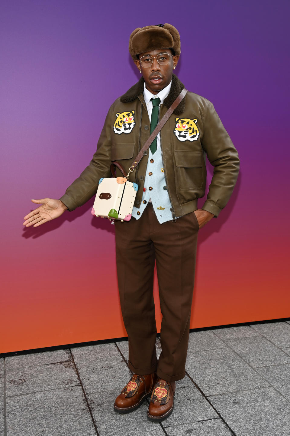 Tyler the creator in brown outfit at Louis Vuitton fall winter 2022 2023 paris fashion week
