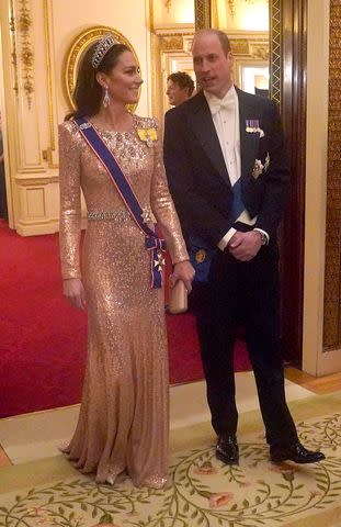 <p>Jonathan Brady - Pool / Getty</p> Kate Middleton and Prince William at the Diplomatic Reception on Dec. 5, 2023