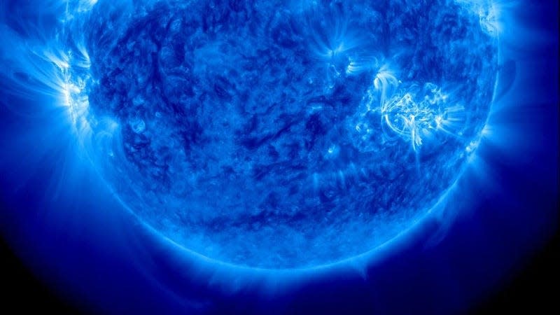 An ultraviolet view of the Sun from earlier today, showing a prominent sunspot at right. - Image: Solar Dynamics Library