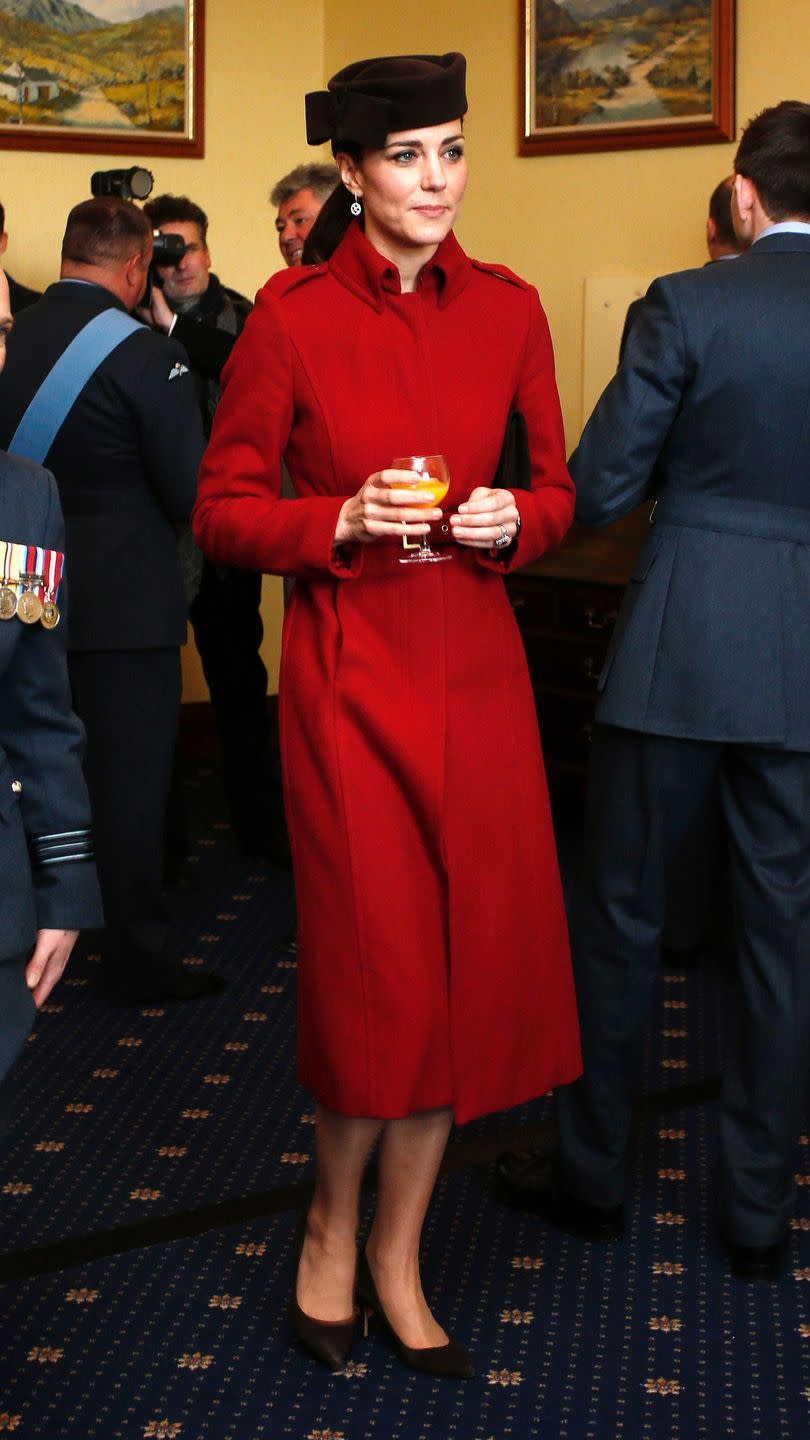 <p>Orange juice for the duchess during a reception for the RAF Search and Rescue Force in Anglesey, north Wales. She wore a favourite hat with her L.K. Bennett coat. </p>