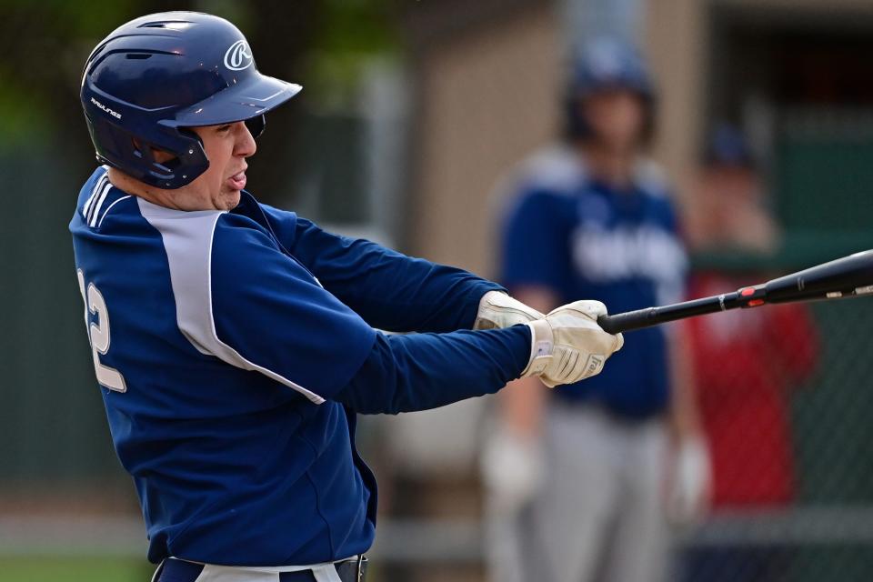 Rootstown's Blake Bower hits a two-run single in the fourth inning of their district semifinal against Cardinal Mooney at Cene Park in Struthers.