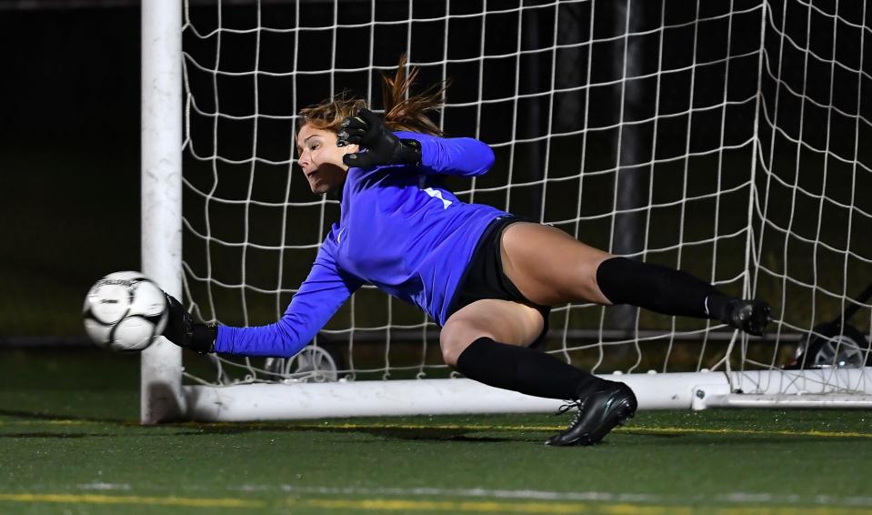 Spencerport goalie Cate Burns makes a save in overtime penalty kicks during a NYSPHSAA Girls Soccer Championships Class A semifinal against South Side-VIII in Cortland, N.Y., Saturday, Nov. 13, 2021.