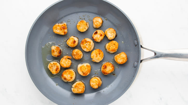 scallops frying in pan