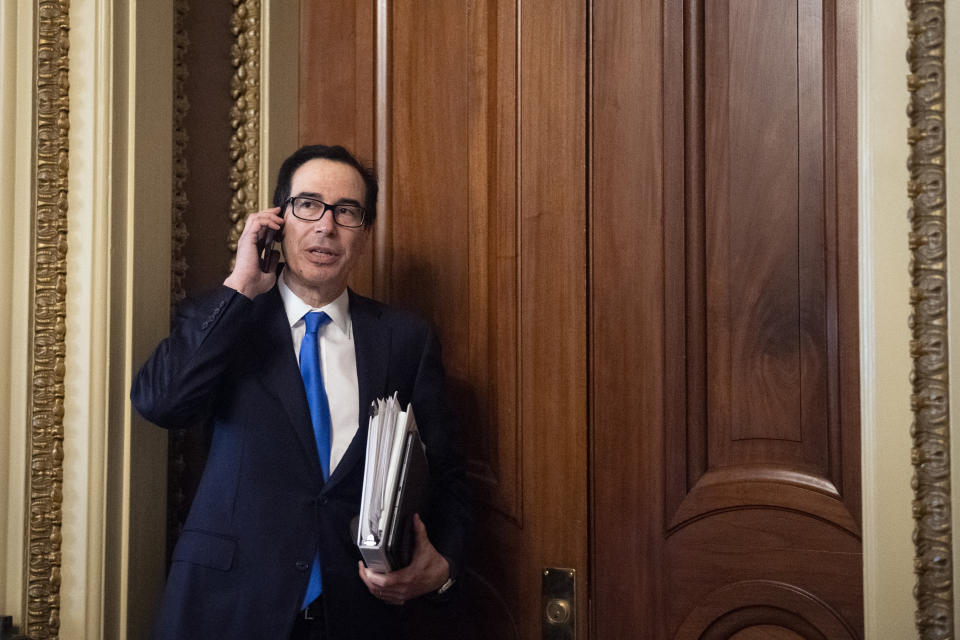 UNITED STATES - MARCH 24: Treasury Secretary Steven Mnuchin takes a phone call as he steps out during a meeting in the Capitol as negotiations continue with congressional leadership on a financial relief package for COVID-19 on Tuesday, March 24, 2020. (Photo by Caroline Brehman/CQ-Roll Call, Inc via Getty Images)